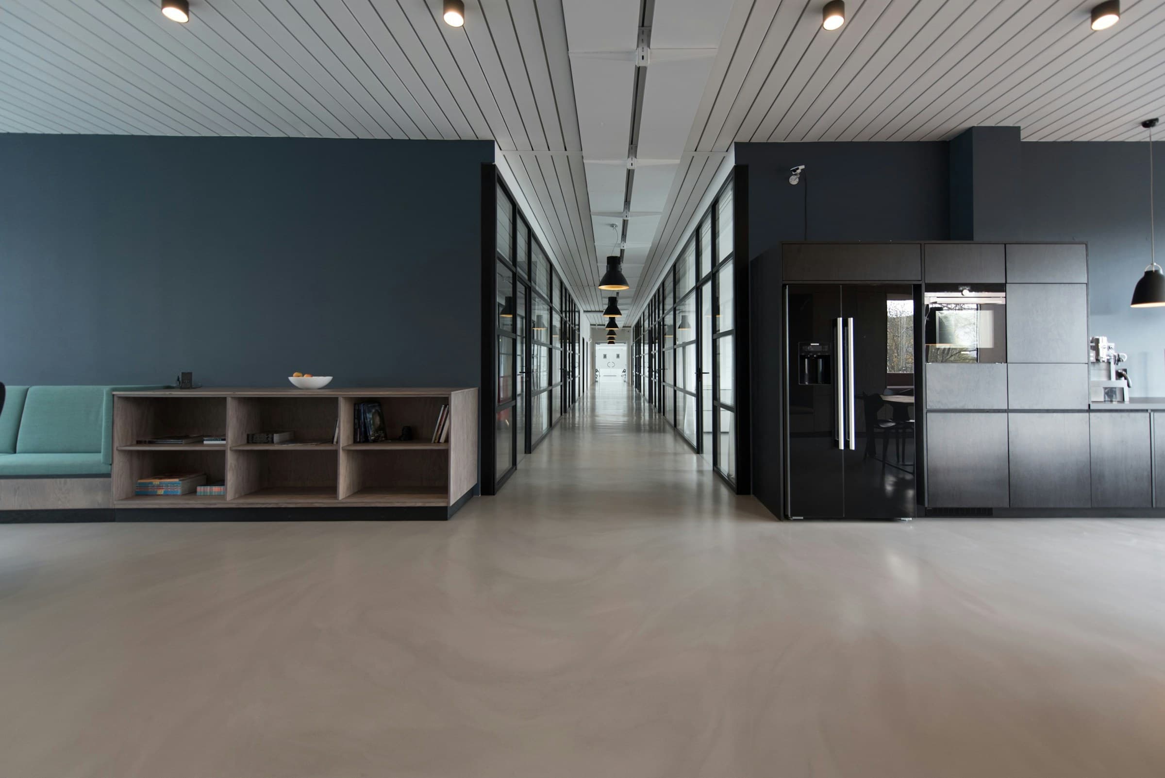Professional cleaner maintaining a bright, modern commercial space